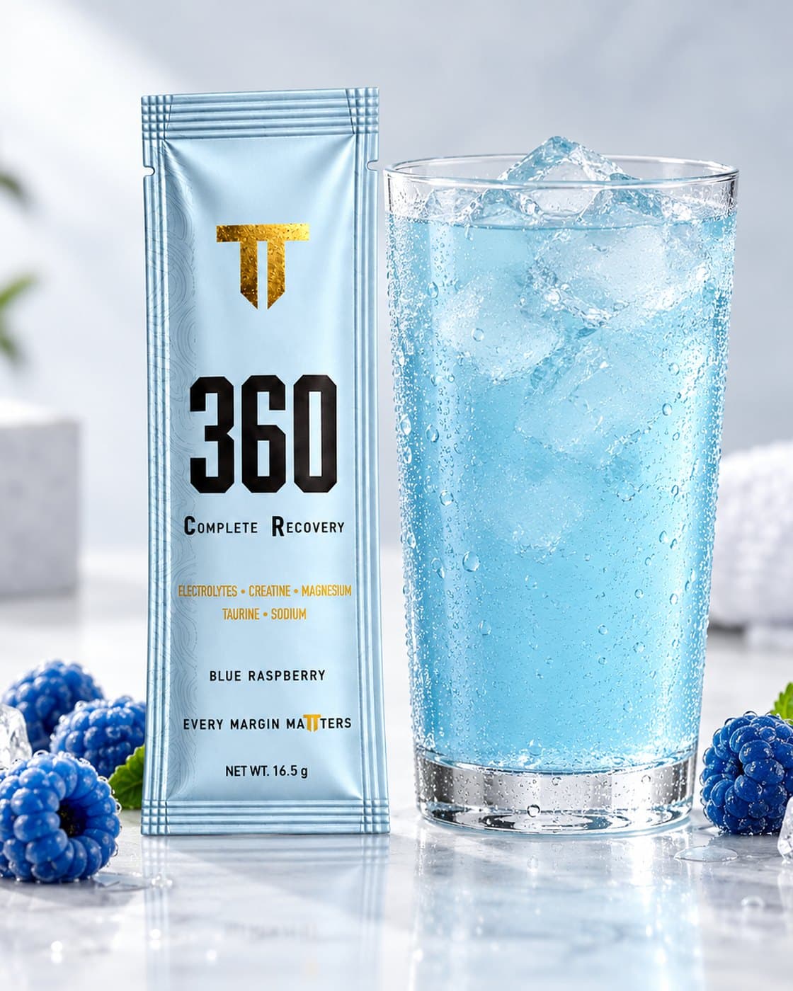 The mixed Blue Raspberry drink over ice, with the sachet beside it